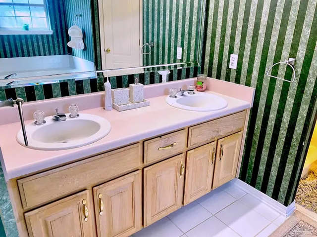 a bathroom with a sink and a mirror