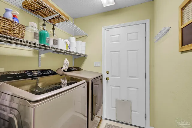 a kitchen that has a sink and a stove