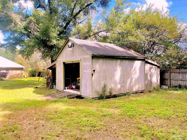a view of a backyard with a small cabin