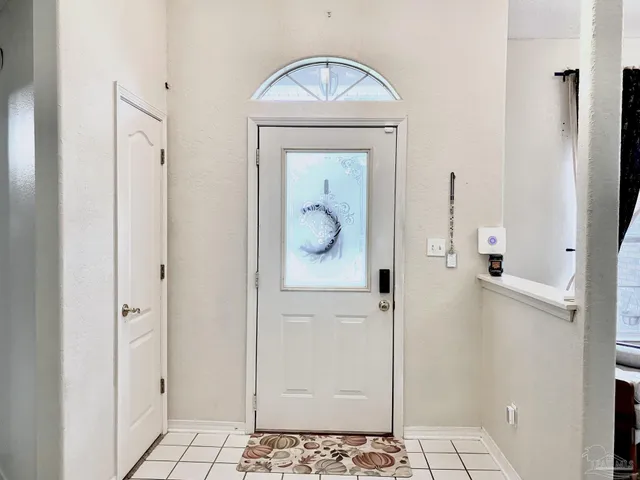 a bathroom with a granite countertop mirror and a shower