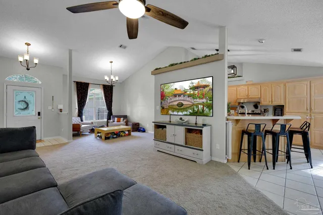 a view of a livingroom with furniture and a flat screen tv