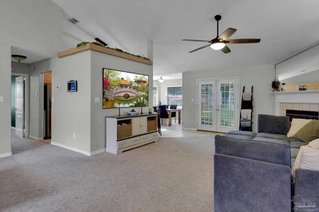 a living room with furniture and a flat screen tv