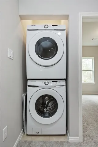 an empty room with closet and a bathroom