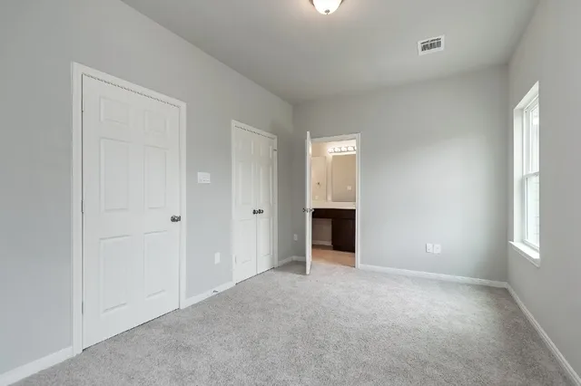 a bathroom with a sink vanity and a mirror