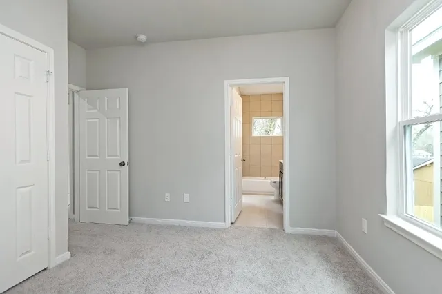 a view of empty room with windows