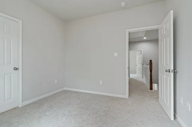 a view of backyard with wooden fence