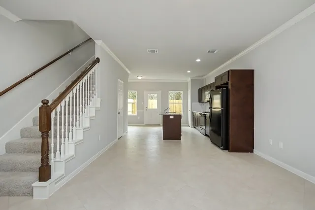 a view of a living room with furniture and a window