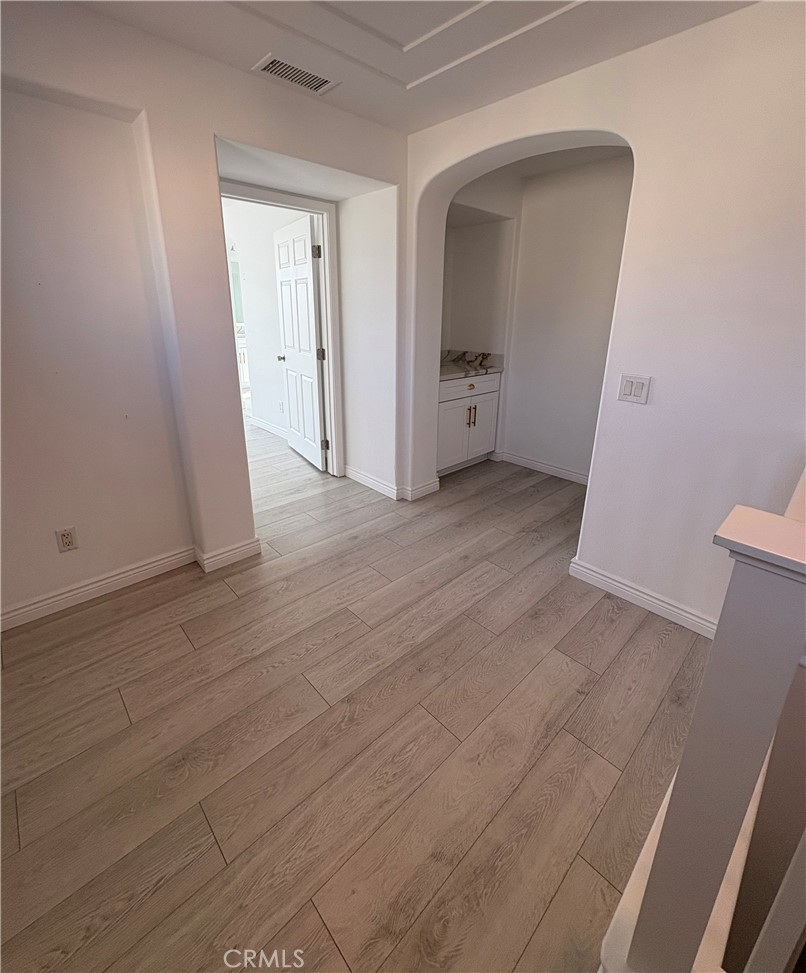 1324 Swan Loop East Upland, CA 91784 - Photo 13 of 27 a view of empty room with wooden floor