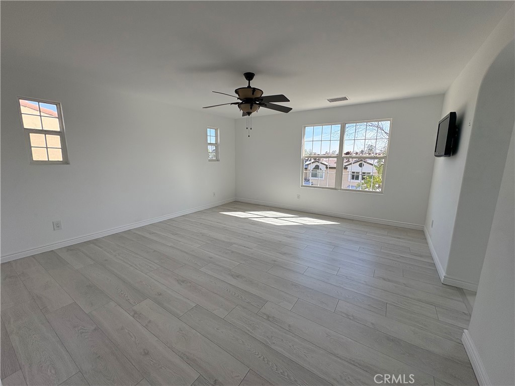 1324 Swan Loop East Upland, CA 91784 - Photo 15 of 27 wooden floor in an empty room with a window