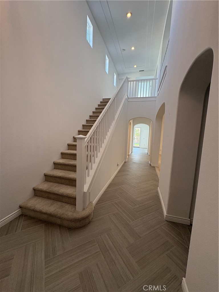 1324 Swan Loop East Upland, CA 91784 - Photo 2 of 27 a view of entryway and hall with wooden floor