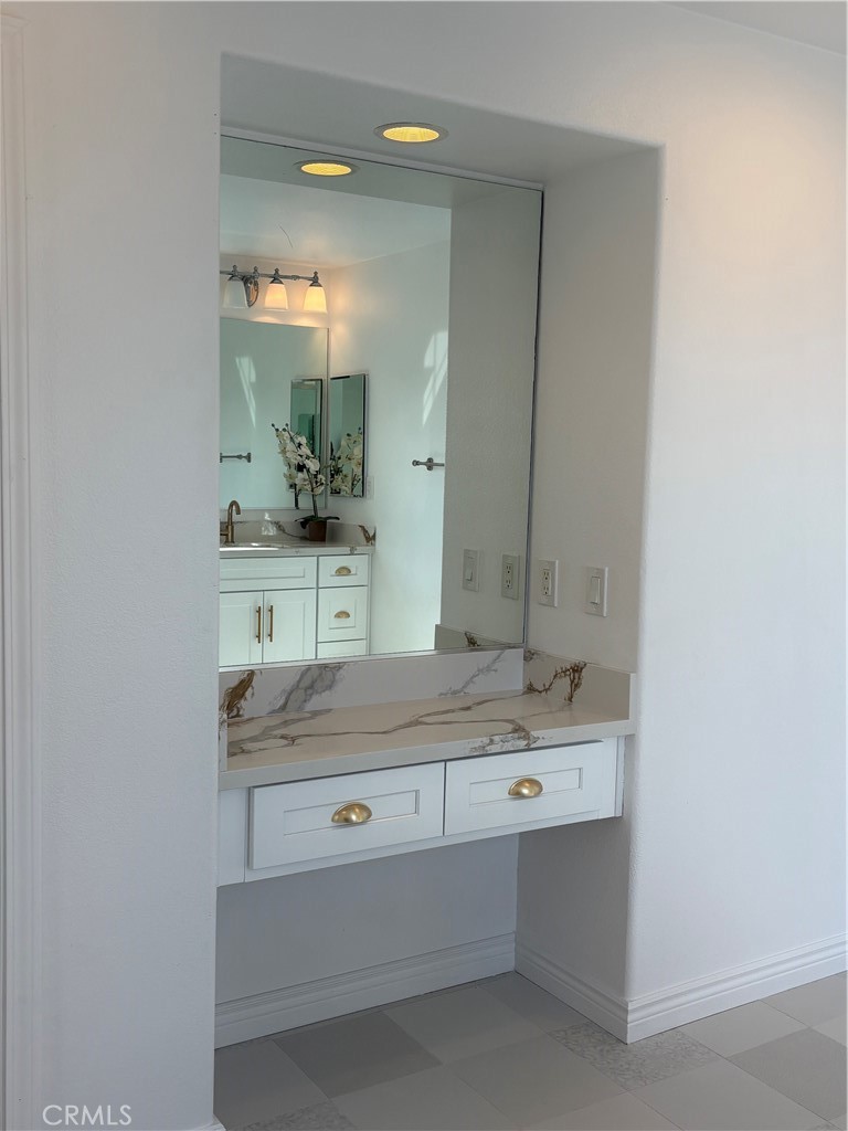1324 Swan Loop East Upland, CA 91784 - Photo 22 of 27 a bathroom with a sink and a mirror