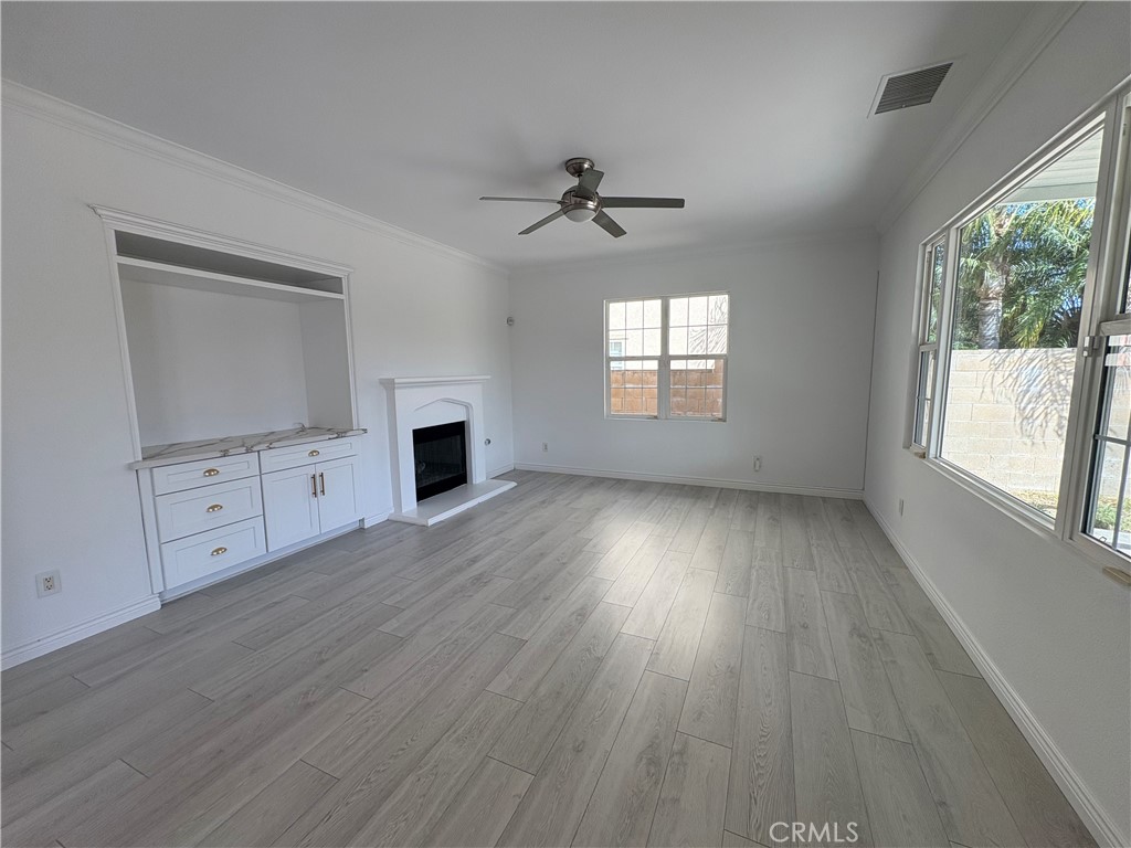 1324 Swan Loop East Upland, CA 91784 - Photo 10 of 27 wooden floor in an empty room with a window