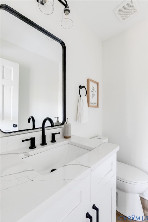 2802 Fairgate Road Midlothian, VA 23112 - Photo 16 of 38 a bathroom with a sink and a mirror