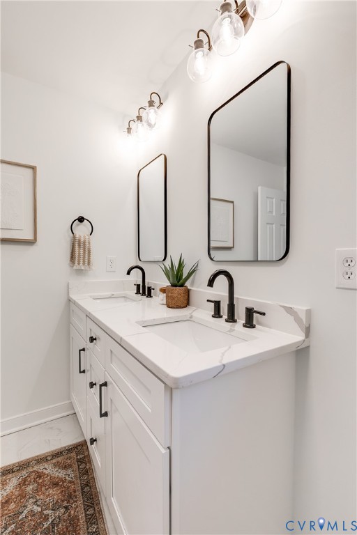 2802 Fairgate Road Midlothian, VA 23112 - Photo 21 of 38 a bathroom with a double vanity sink and a mirror