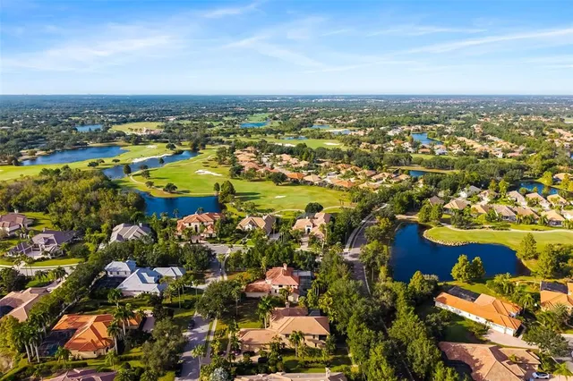 a kitchen with granite countertop white cabinets and stainless steel appliances