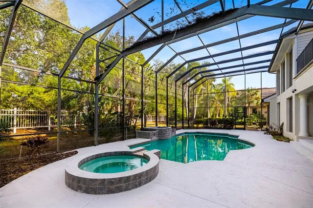 a view of a kitchen with furniture and an empty room