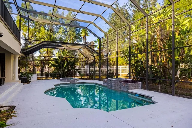 a white bath tub sitting in a bathroom next to a window