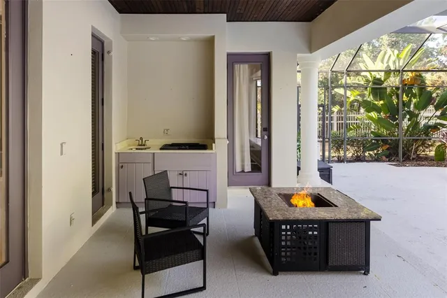 a view of an empty room with window and ceiling fan