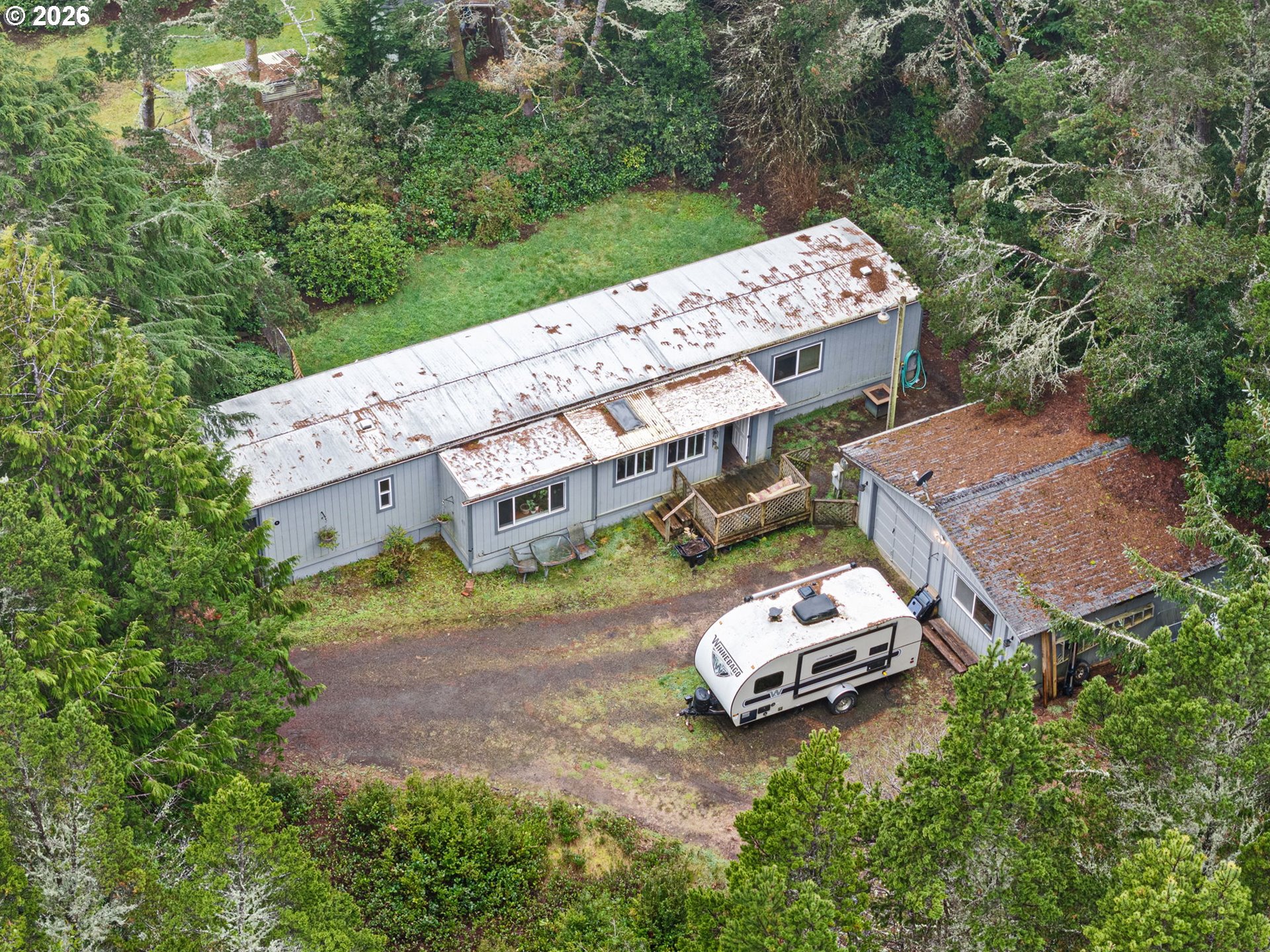 4826 Rhododendron Loop Florence, OR 97439 - Photo 33 of 41 an aerial view of a house with a yard
