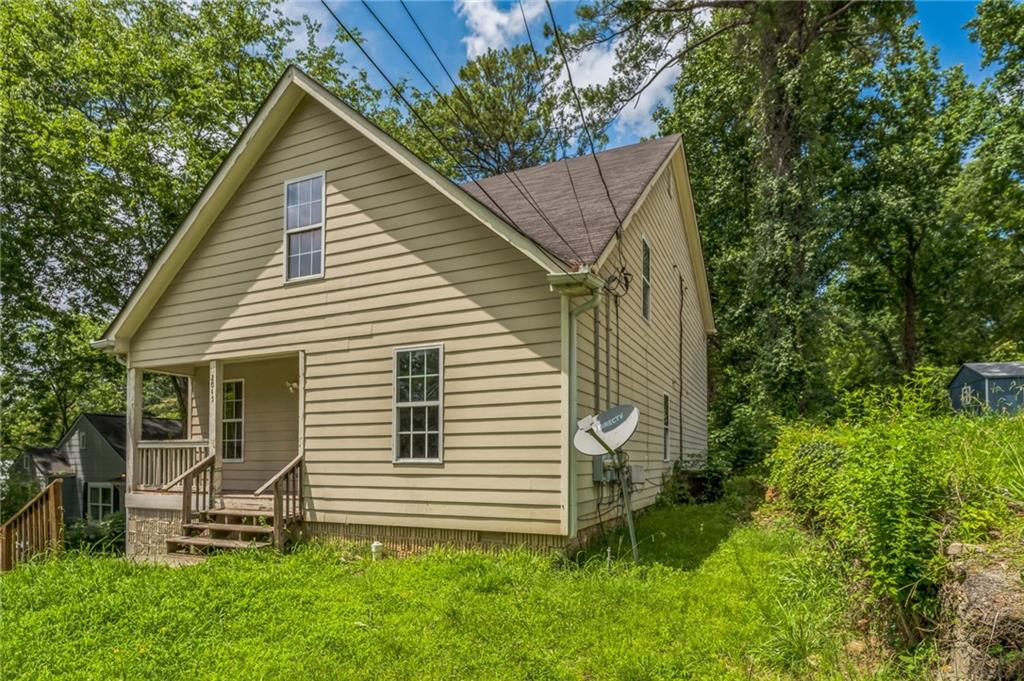 2045 Baker Road Northwest, Unit A Atlanta, GA 30318 - Photo 2 of 15 a view of a house with a yard