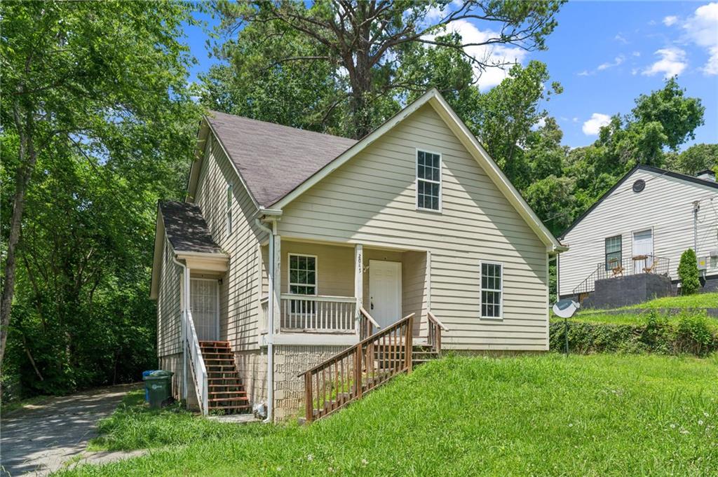 2045 Baker Road Northwest, Unit A Atlanta, GA 30318 - Photo 3 of 15 a view of a house with a yard
