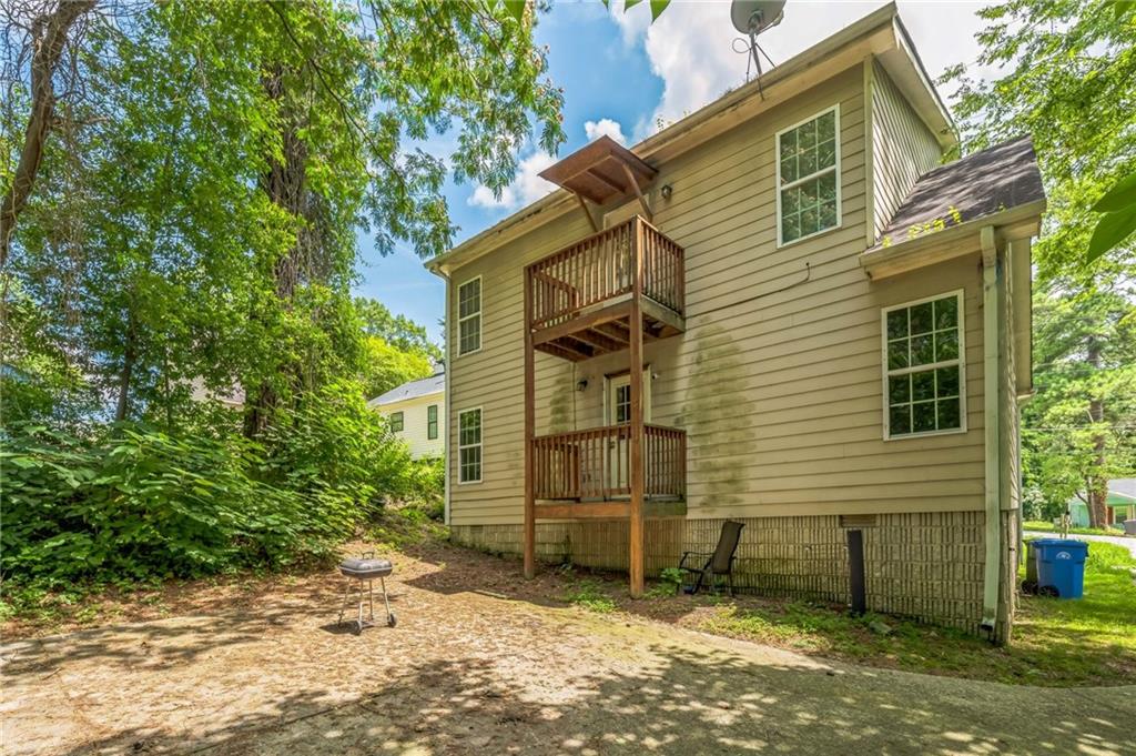 2045 Baker Road Northwest, Unit A Atlanta, GA 30318 - Photo 4 of 15 a view of a house with a yard