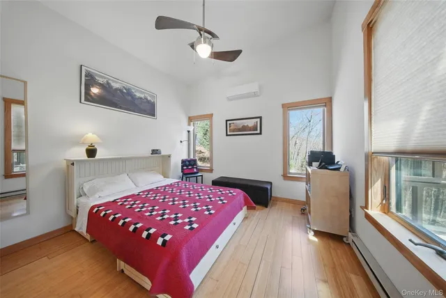 a bedroom with a bed and a dresser in it