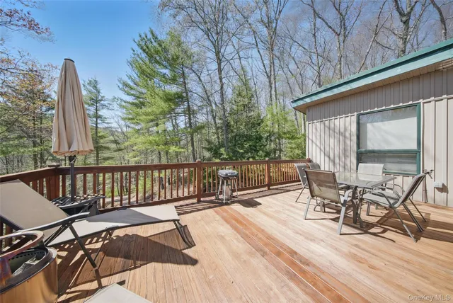 a view of a chairs and table in the patio