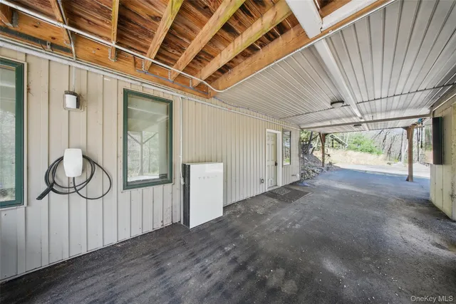 a view of a room with furniture and windows