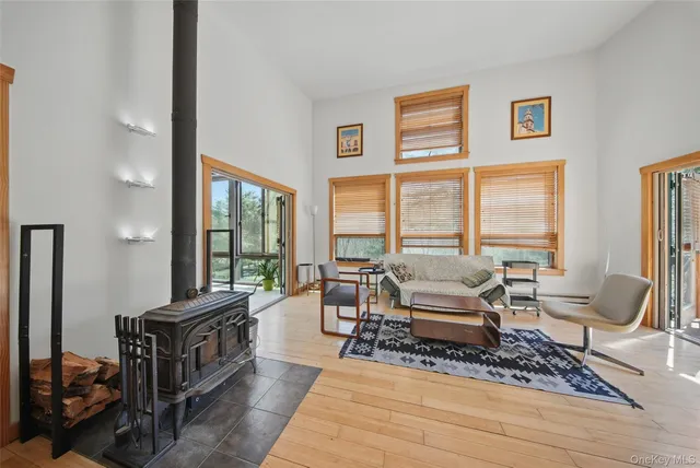 a view of a chairs and table in backyard