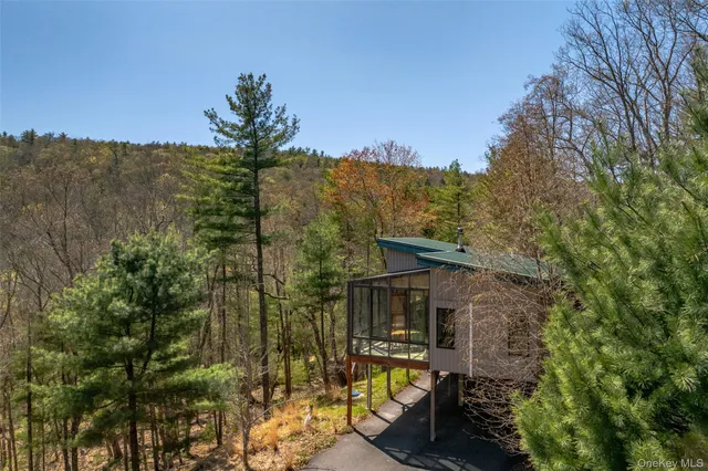 a bedroom with bed and window