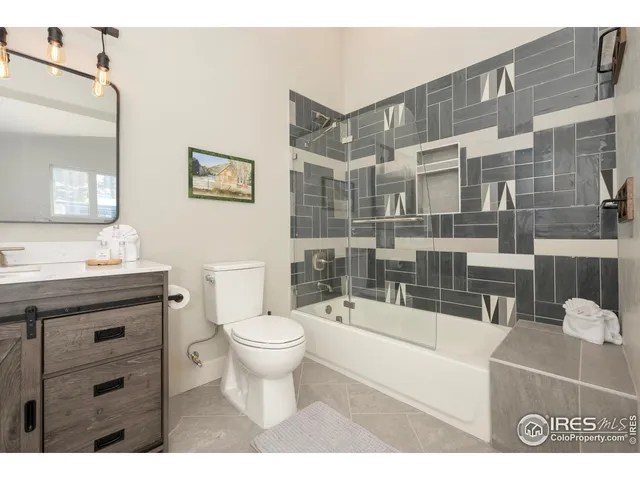 a view of bathroom with shower and a bathroom