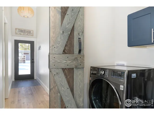 a bathroom with a double vanity sink toilet mirror and shower