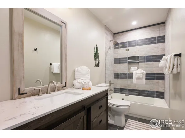 a aerial view of a house with table and chairs