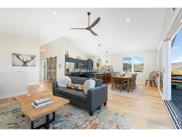 a kitchen with stainless steel appliances granite countertop a sink counter space and a window