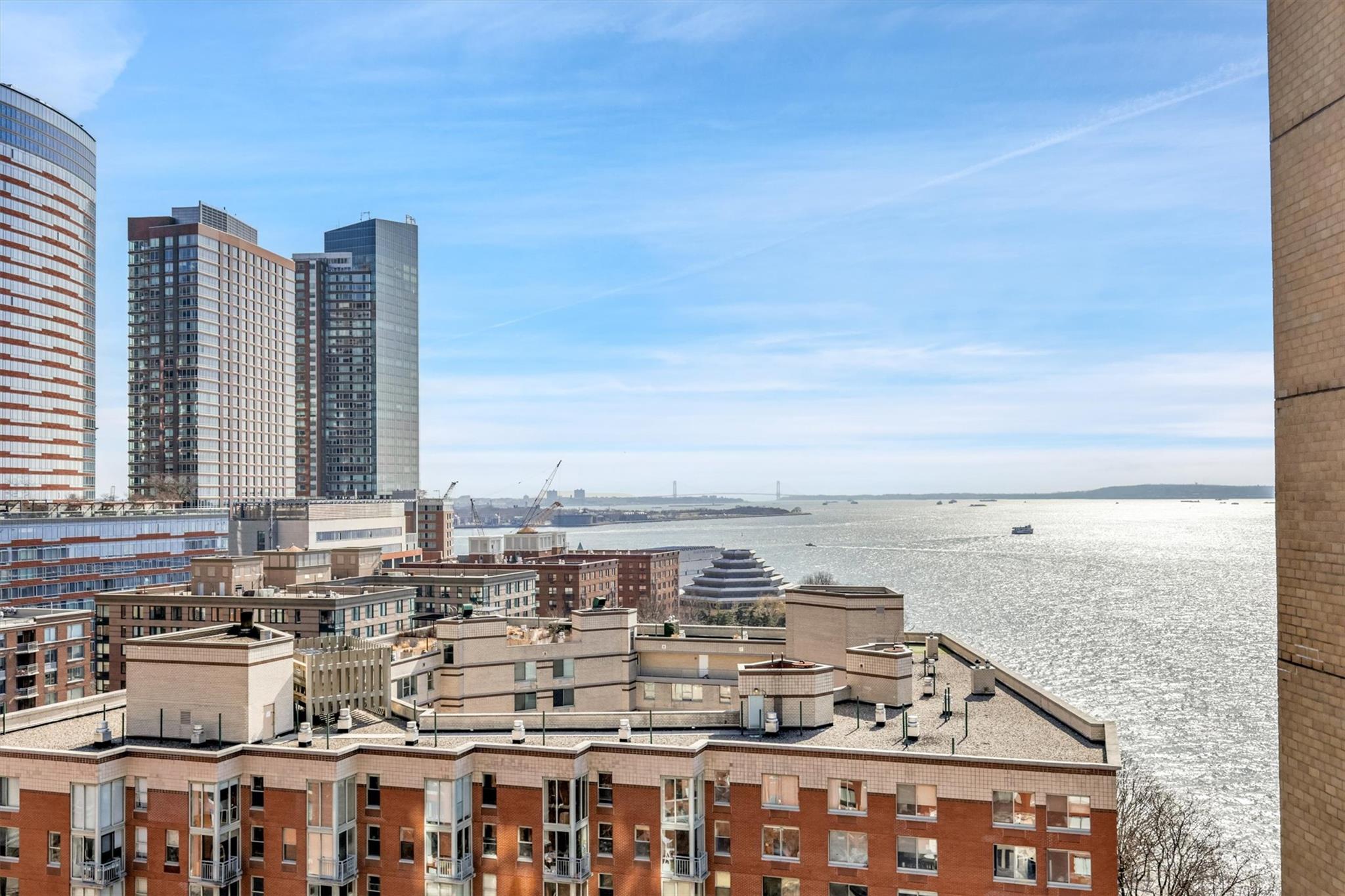 380 Rector Place, Unit 15E Manhattan, NY 10280 - Photo 27 of 31 Property's view of city with a water view