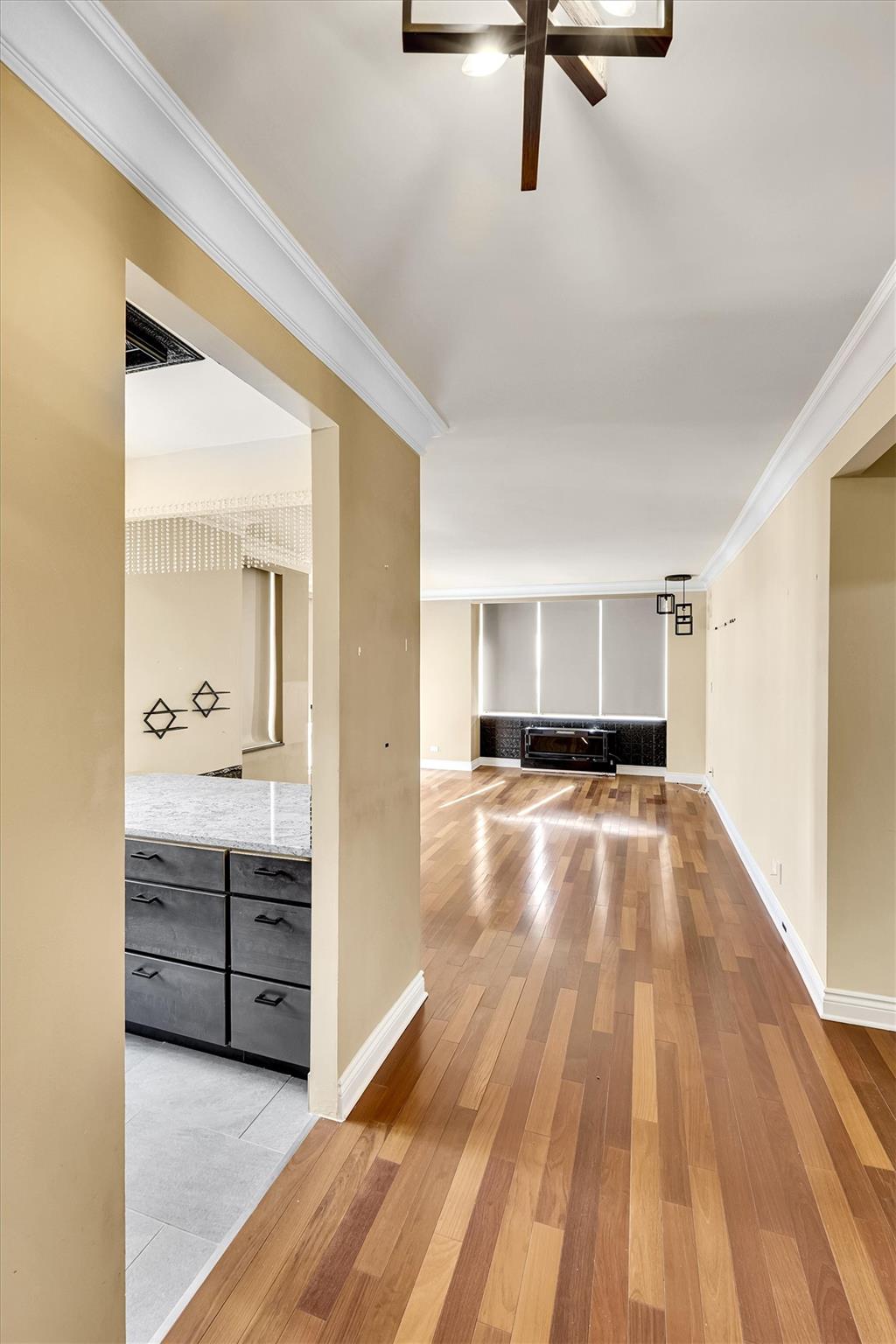 380 Rector Place, Unit 15E Manhattan, NY 10280 - Photo 7 of 31 Hall featuring light wood-type flooring, baseboards, and crown molding