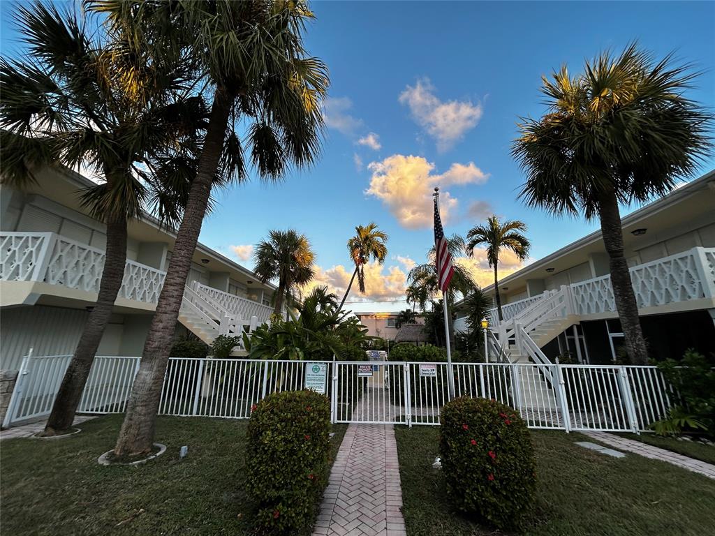 4630 Poinciana Street, Unit 1C Lauderdale-by-the-Sea, FL 33308 - Photo 7 of 7 a view of a house with a yard