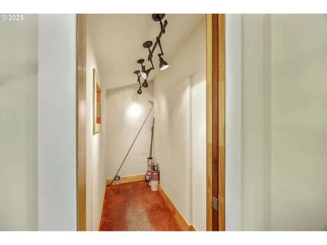 a view of a hallway with a flower pot