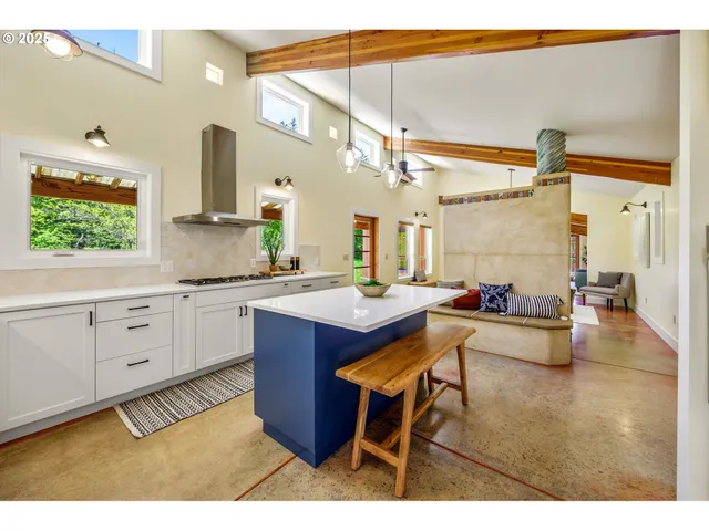a kitchen with sink and view living room