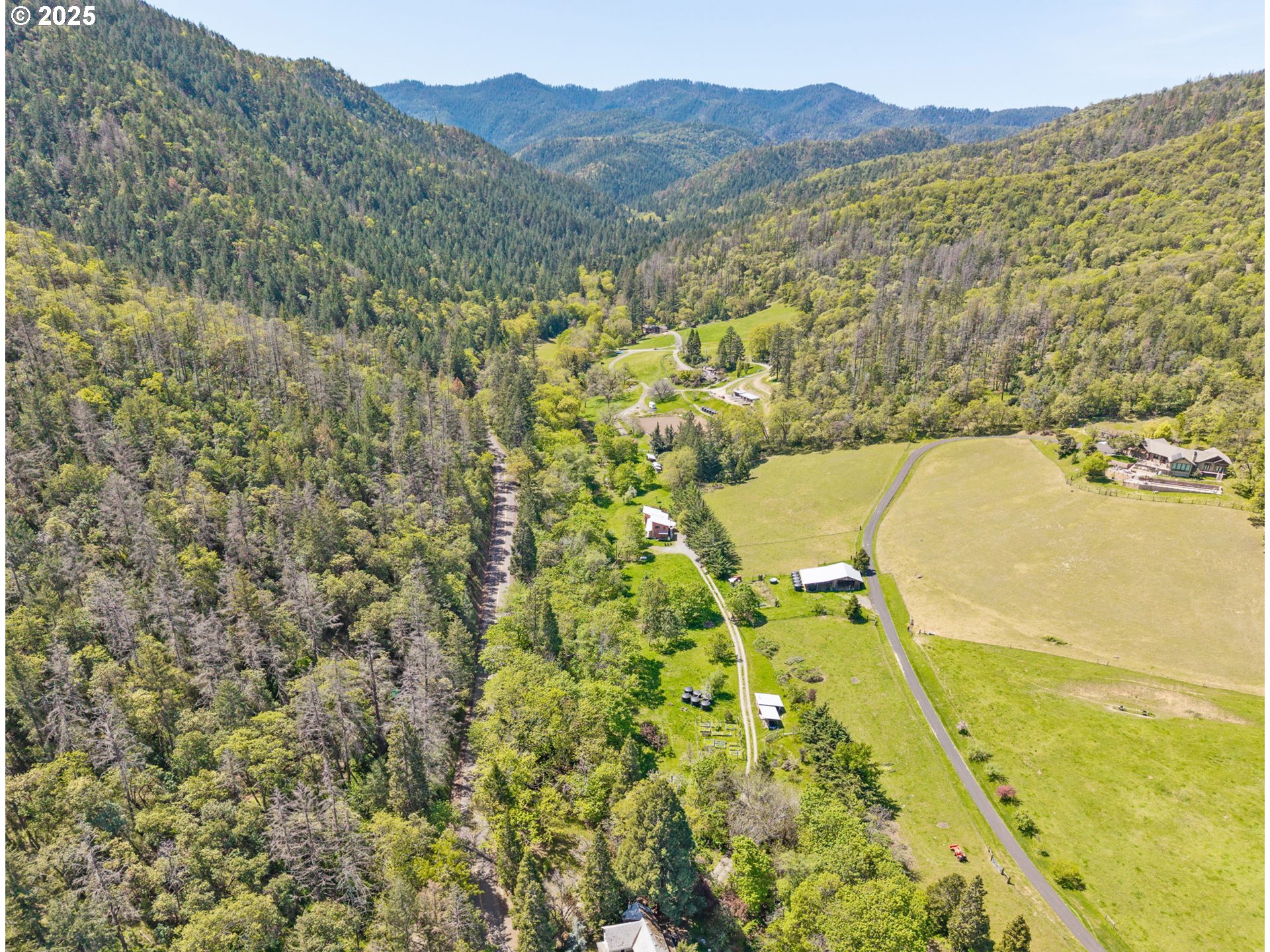 1848 Anderson Creek Road Talent, OR 97540 - Photo 22 of 48 a view of a lake with a mountain