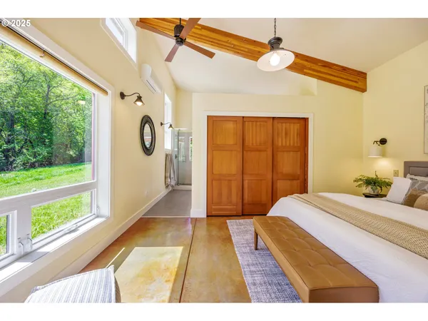 a living room with a couch and a dining table
