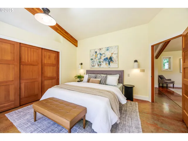 a spacious bathroom with a sink double vanity granite and a mirror