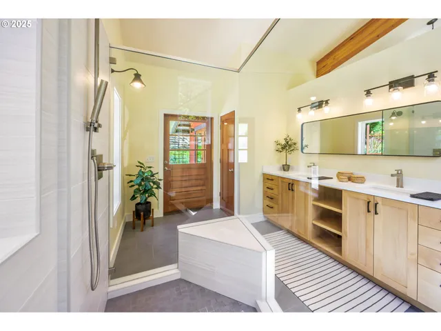 a living room with furniture a rug and a large window