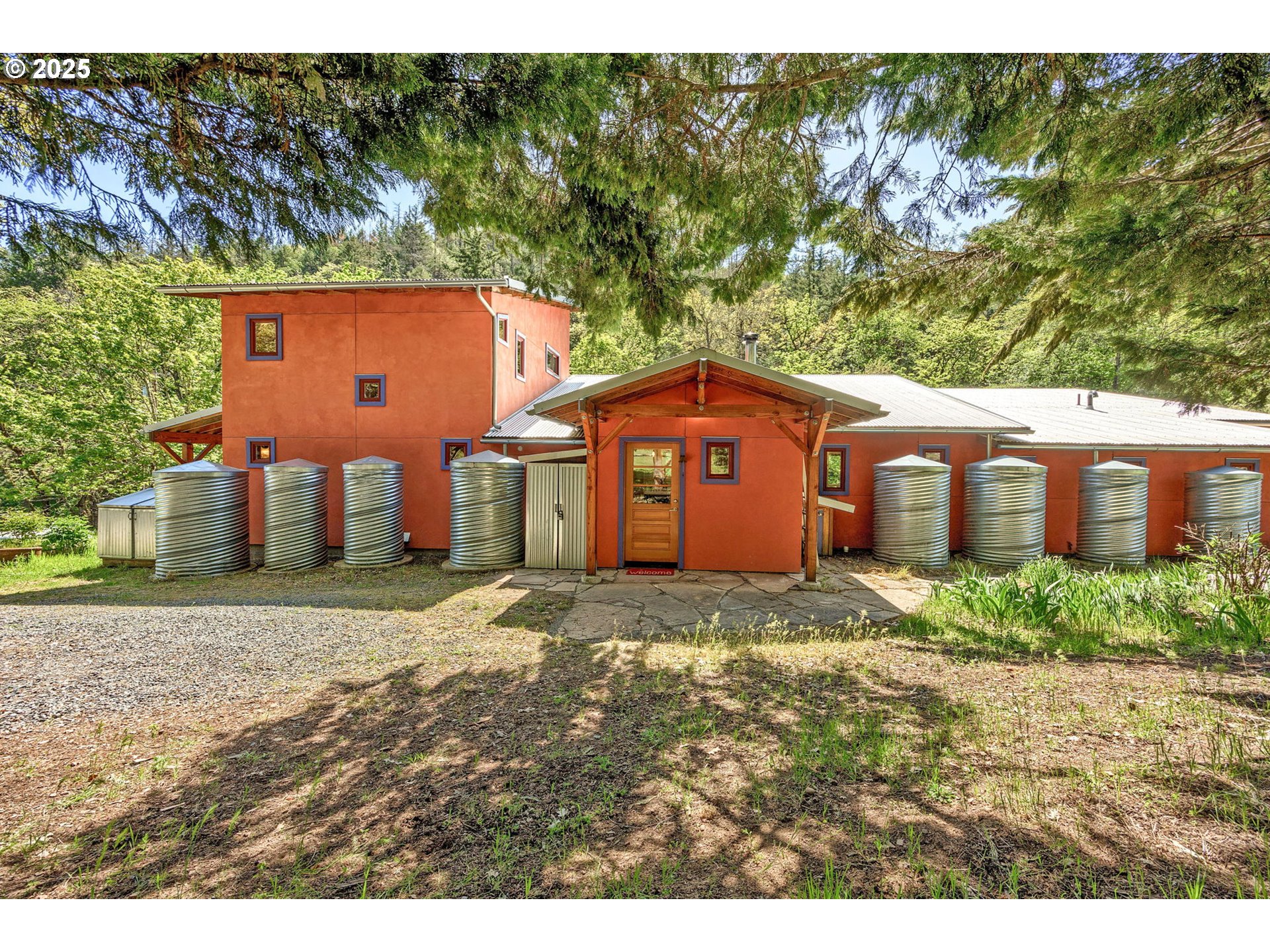 1848 Anderson Creek Road Talent, OR 97540 - Photo 4 of 48 a view of a yard in front of a house with large trees