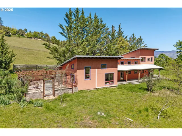 a kitchen with stainless steel appliances a white stove top oven cabinets a chimney and a window