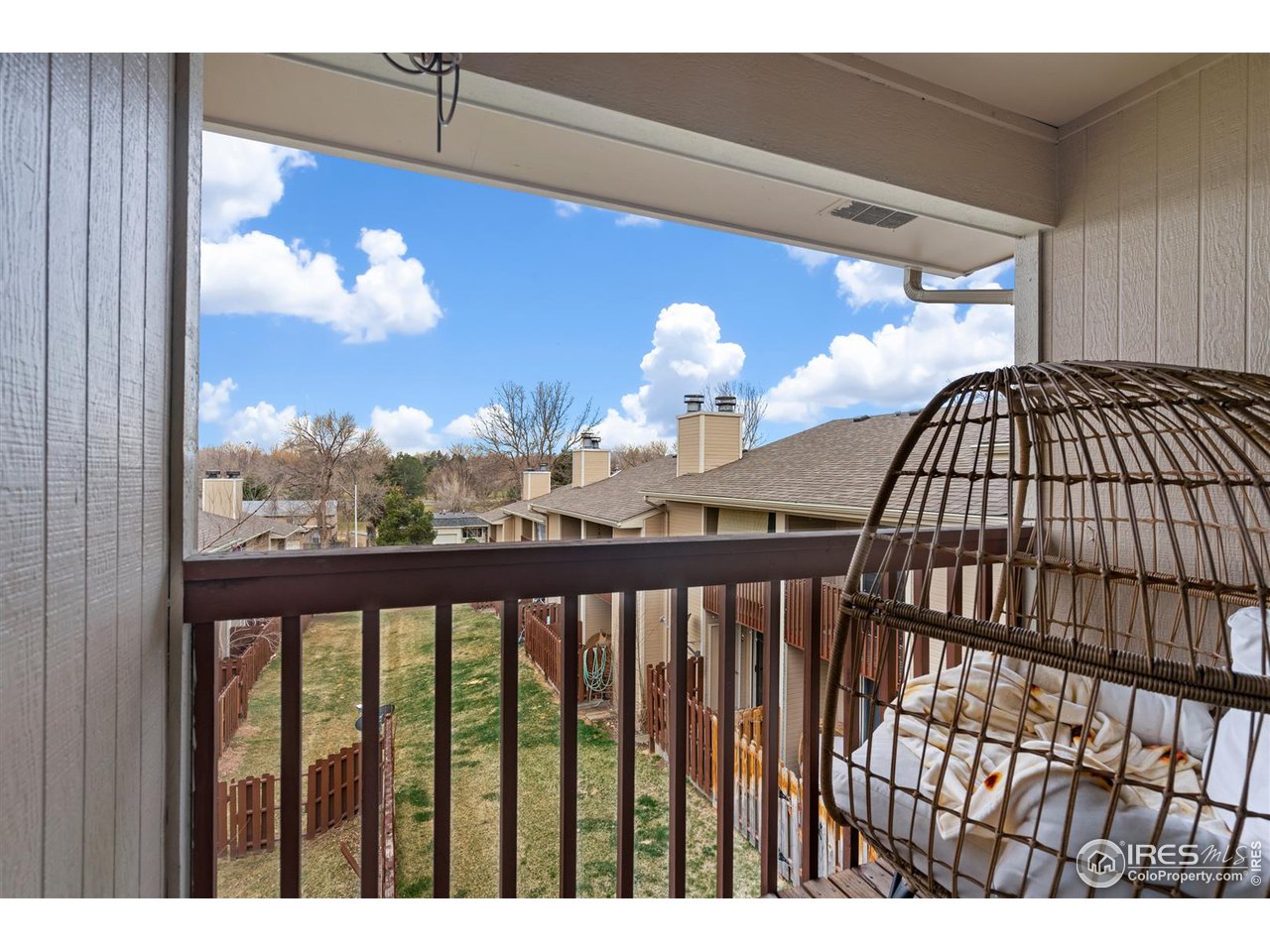 1440 Edora Road, Unit 13 Fort Collins, CO 80525 - Photo 12 of 20 Private, covered balcony overlooking open space with views toward Edora Park