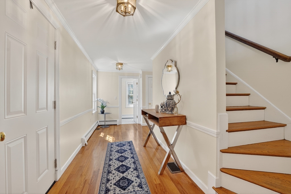 71 Robert Best Road Sudbury, MA 01776 - Photo 11 of 31 a view of entryway and hall with wooden floor