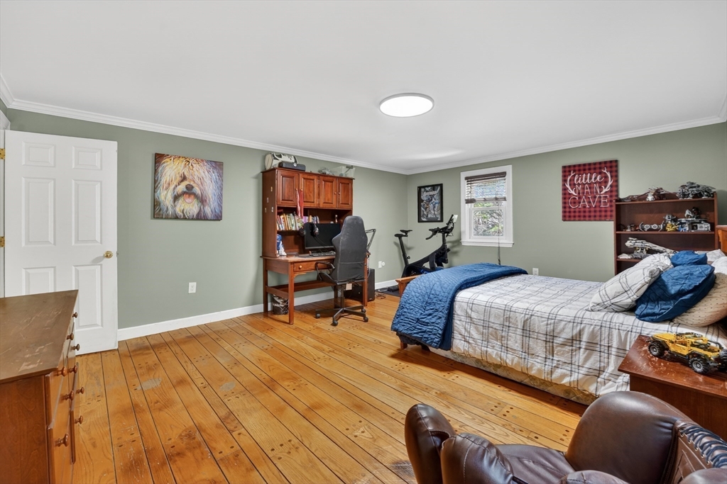 71 Robert Best Road Sudbury, MA 01776 - Photo 16 of 31 a bedroom with bed and a couch