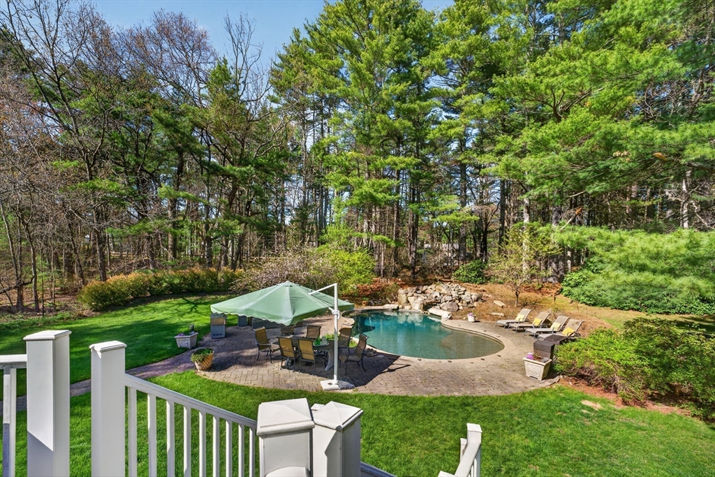71 Robert Best Road Sudbury, MA 01776 - Photo 28 of 31 a view of a garden with plants and large trees